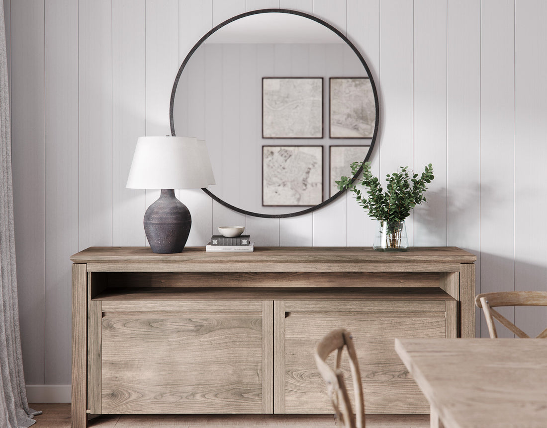Table lamp on hallway console table with mirror and vase
